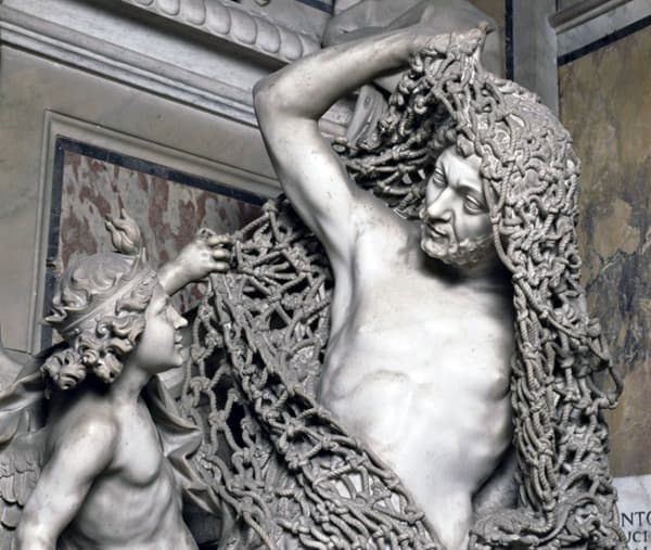 Close view of the carved net draped over Il Disinganno.